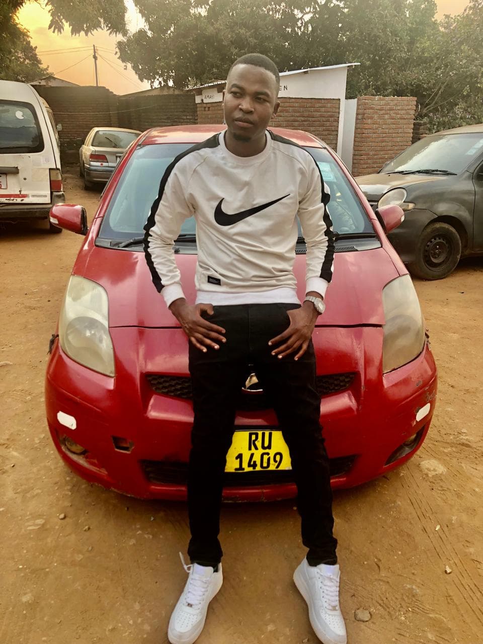 Harry Salamba, taxi driver in Blantyre, with his Vitz